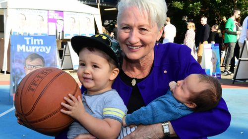 Kerryn Phelps smiles with her grandchildren on election day in Sydney.