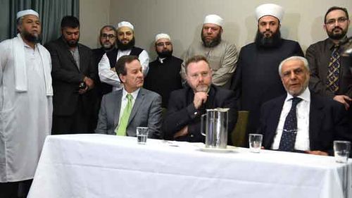 Religious leaders from the Muslim and Christian communities including Dr Ibrahim Abu Mohamed (right), Grand Mufti of Australia, gather for a media press conference in Bankstown. Source: AAP