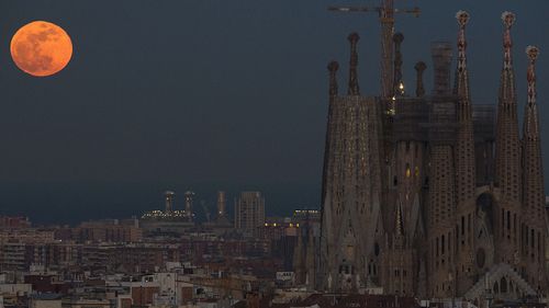Barcelona's Sagrada Familia Basilica is backdropped by a super blue blood moon. (AAP)