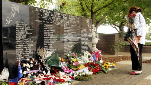 Wreaths laid after a memorial service on the 28th anniversary of the Granville Train disaster in 2004. Source: AAP