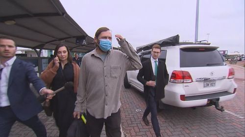 Tobias Moran arrives back at Perth Airport after being released on bail.