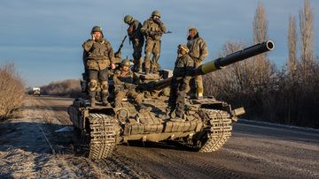 Ukrainian soldiers who left Debaltseve yesterday prepare to return to support the further withdrawal of troops on February 19, 2015 in Artemivsk, Ukraine