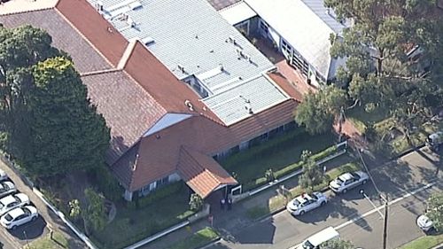 Police and emergency services at Longueville Hospital. (9NEWS)