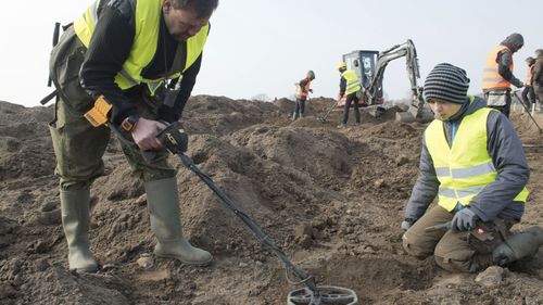 Rene Schoen and 13-year-old Luca Malaschnitschenko were using metal detectors on the field near the village Schaprode when Luca found a piece of metal he thought was aluminium rubbish.