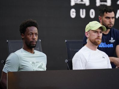 Gael Monfils, left, watches his wife, Elina Svitolina of Ukraine, from the coaches box, play Jasmine Paolini of Italy in their third round match at the Australian Open tennis championship in Melbourne, Australia, Saturday, Jan. 18, 2025. (AP Photo/Vincent Thian)