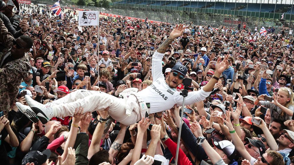 Hamilton delights fans, Rosberg penalised