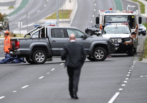 Police teams search an abandoned ute believed to be involved in Paul Virgona's slaying. The Volkswagon Amarok was ditched on The Mountain Highway in Bayswater.