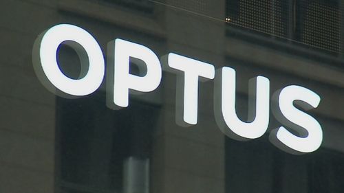 A close-up shot of an Optus store sign