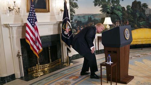 Trump searches for water during a speech on Nov. 15, 2017. Photo: AP