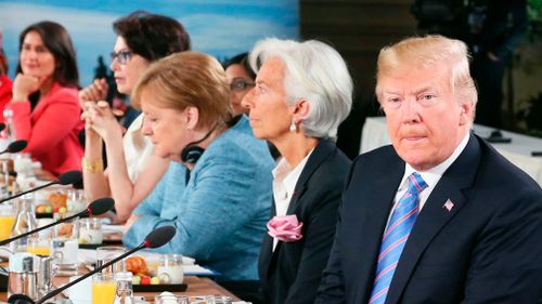 Donald Trump, pictured on Saturday at a meeting with German prime minister Angela Merkel, backed out of signing the group's joint statement. Picture: AP