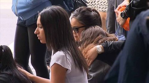 Friends gather at the scene to mourn their friend. (9NEWS)