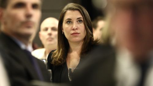 Journalist Annika Smethurst listen on as News Corp Chairman Michael Miller speaks on Press Freedom following AFP raids on the ABC and a journalist from The Australian at the National Press Club in Canberra 