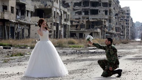 Syrian couple pose for wedding photos in ghostly, war-ravaged Homs