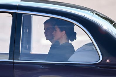 LONDON, ENGLAND - SEPTEMBER 14: Sophie, Countess of Wessex and Meghan, Duchess of Sussex are driven in a car during the procession for the Lying-in State of Queen Elizabeth II on September 14, 2022 in London, England. Queen Elizabeth II's coffin is taken in procession on a Gun Carriage of The King's Troop Royal Horse Artillery from Buckingham Palace to Westminster Hall where she will lay in state until the early morning of her funeral. Queen Elizabeth II died at Balmoral Castle in Scotland on Se
