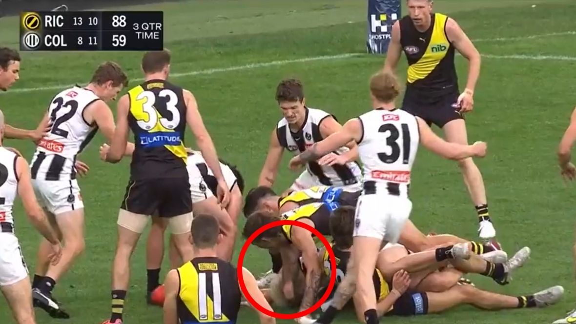 Collingwood&#x27;s Jack Ginnivan is pushed in the head by Richmond&#x27;s Rhyan Mansell.