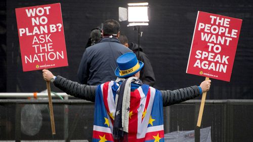 Anti Brexit protestor Steve Bray attempts to appear in shot behind a television crew on Abingdon Green, outside the Houses of Parliament, in Westminster, London.