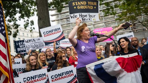 Protestors gather outside the Russell Senate Office Building in Washington DC.