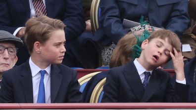 Prince George, Prince Louis and Prince William, Prince of Wales attend to watch the military procession for the 80th anniversary of VE Day, in honour of those who served during the Second World War, at Buckingham Palace on May 5, 2025 in London, England. 