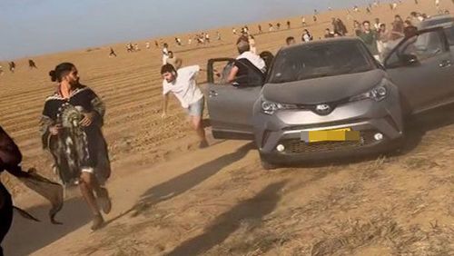People flee the Hamas attack on a music festival near the Gaza-Israel border.