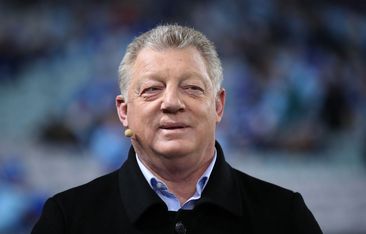Phil Gould smiles during a tv broadcast.