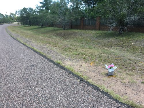 Flowers at the scene where the 17-year-old was killed.