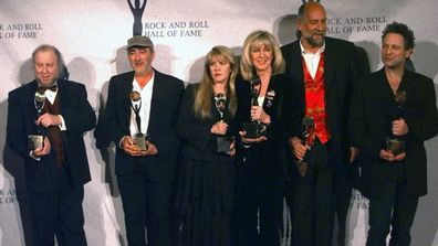 Members of Fleetwood Mac hold their awards after the group was inducted into the Rock and Roll Hall of Fame, in New York. From left, are: Peter Green; John McVie; Stevie Nicks; Christine McVie; Mick Fleetwood; and Lindsey Buckingham. (Photo: Monday, Jan. 12, 1998)
