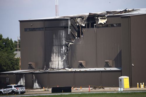 Ten people were confirmed killed when a private plane crashed into the side of a hangar at Addison Municipal Airport on Sunday.