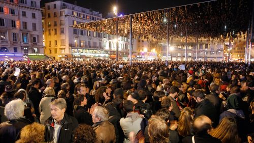 People gather during a demonstration at the Old Port of Marseille in southern France. (AAP)