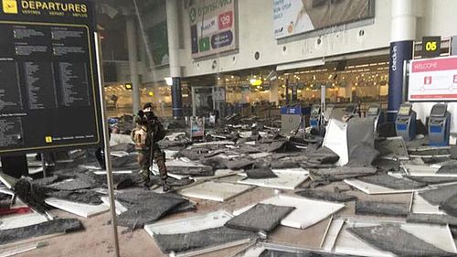 Damage inside the Zevantem Airport departures hall. (Twitter)