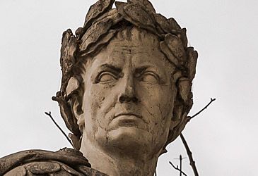 What was Julius Caesar's highest title at the time of his murder?