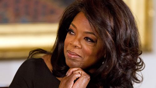 Oprah Winfrey listens in the East Room of the White House in Washington in November 2013. (AAP)