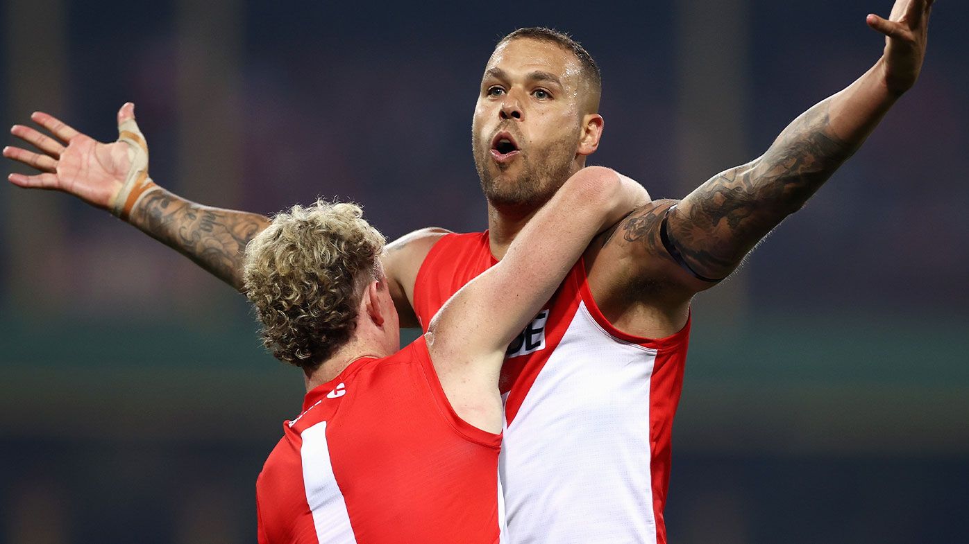 Lance Franklin of the Swans celebrates kicking a goal with Chad Warner 