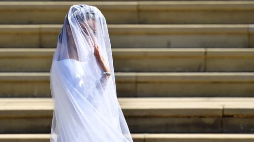 Ms Markle waves to the crowds outside the chapel. Picture: AP