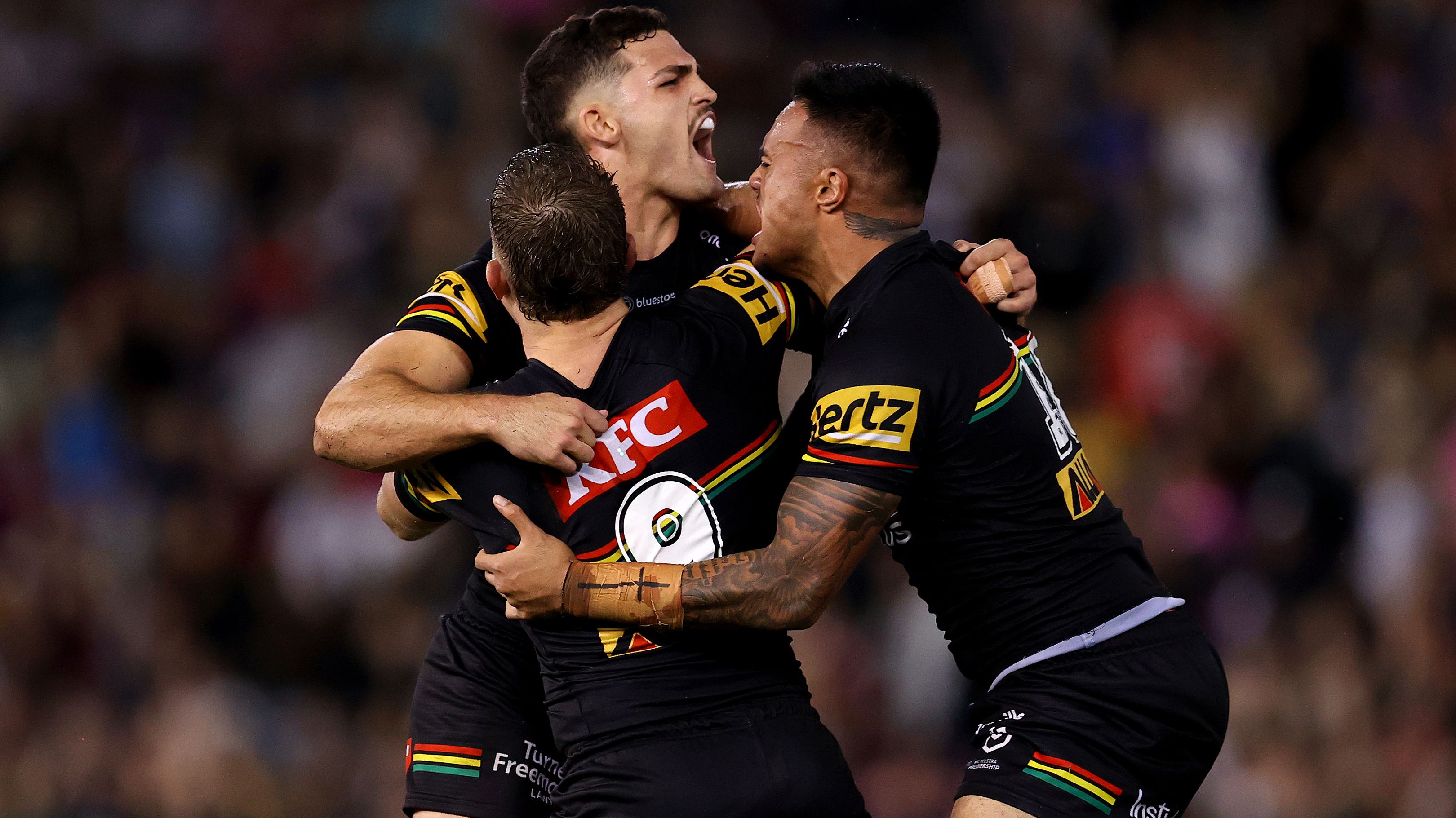 Nathan Cleary of the Panthers celebrates with team mates Mitch Kenny and Spencer Leniu after kicking the winning field goal in golden point during the round seven NRL match between Newcastle Knights and Penrith Panthers at McDonald Jones Stadium on April 15, 2023 in Newcastle, Australia. (Photo by Brendon Thorne/Getty Images)