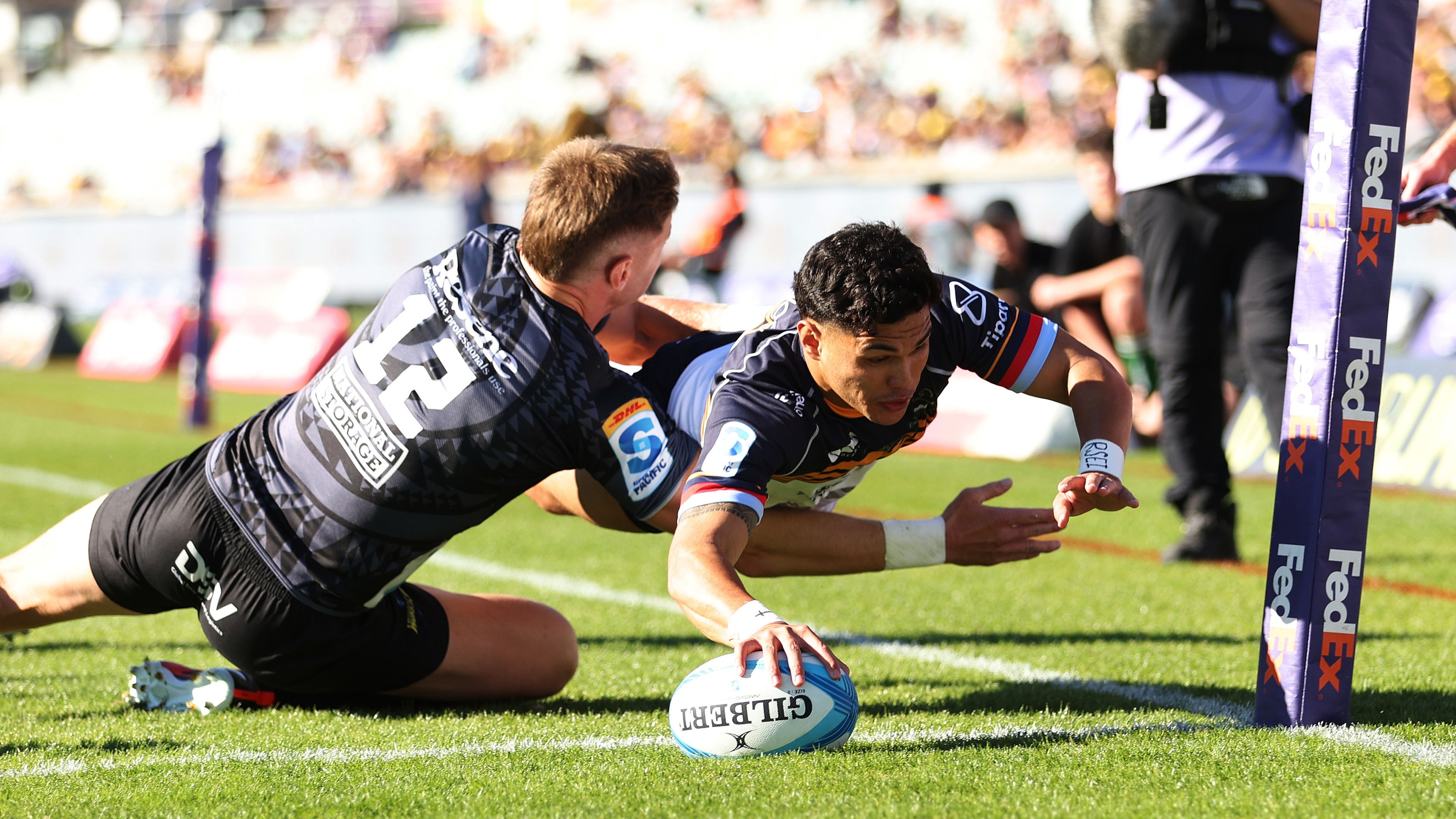 Noah Lolesio of the Brumbies scores a try.