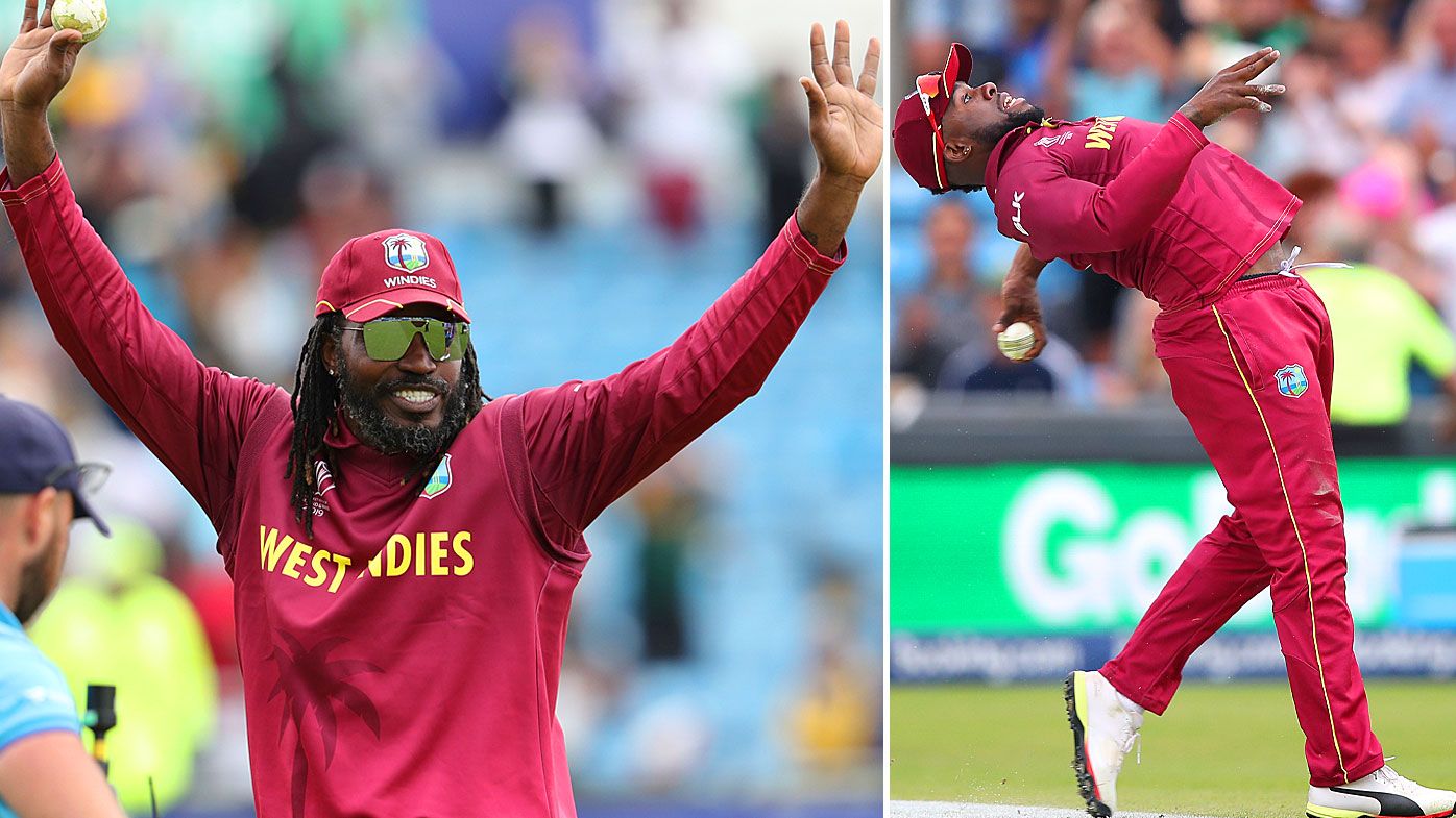 Gayle acknowledges the crowd as Allen celebrates his cracking catch