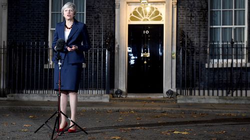 UK Prime Minister Theresa May announces outside 10 Downing Street that she has the support of her cabinet for Britain's Brexit deal with the EU.