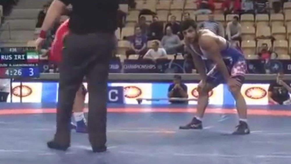Iranian wrestler angry at enforced loss to avoid potential Israeli opponent
