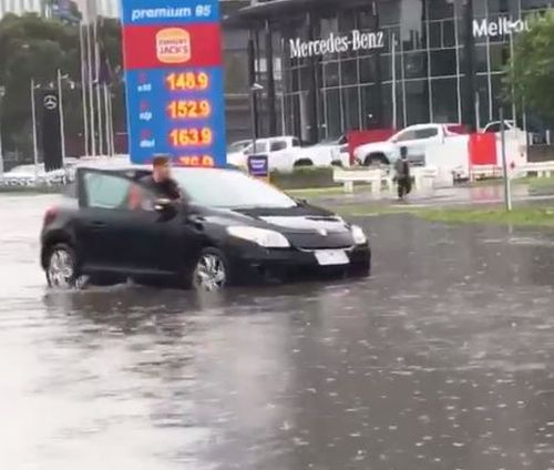 On the Kingsway, motorists were left pushing their vehicles through floodwaters.