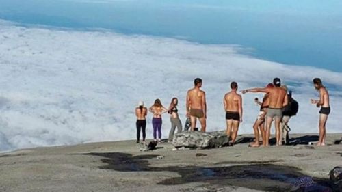 British backpacker 'sorry' for topless photo on sacred mountain