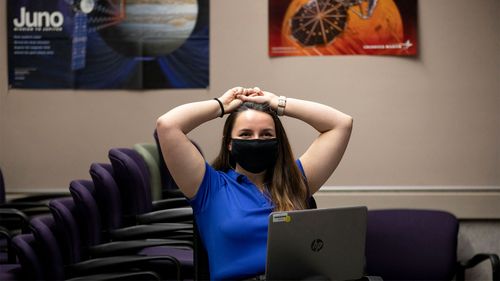 Engineer Sierra Gonzales watches a broadcast of the landing on Mars of NASA's Perseverance rover at Lockheed Martin Space's Waterton Campus in Colorado.