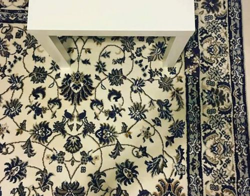 Can you spot the phone in this picture of a rug?