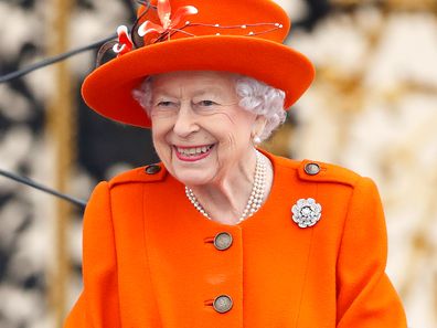 Queen Elizabeth II (Patron of the Commonwealth Games Federation), wearing her Nizam of Hyderabad diamond rose brooch, attends the launch of the Queen's Baton Relay for Birmingham 2022, the XXII Commonwealth Games at Buckingham Palace on October 7, 2021 in London, England. The Queen's Baton Relay will span 294 days, during which the Baton will visit all 72 nations and territ