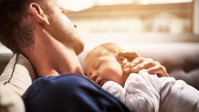 Dad settling baby resting father child parenting newborn