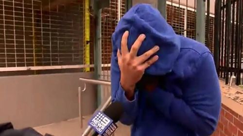 Eric Balanay has been accused of filming women in change rooms or the bathroom but outside court today he was camera-shy. Picture: 9NEWS