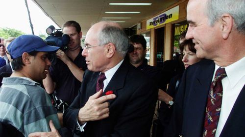 Prime Minister John Howard spruiks the virtues of Liberal candidate Gary Nairn in Queanbeyan, in the seat of Eden-Monaro in 2001.