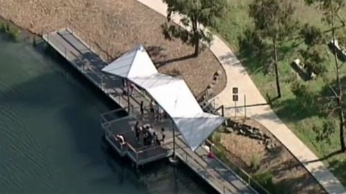 The teen jumped off the shelter but landed on a nearby railing. (9NEWS)