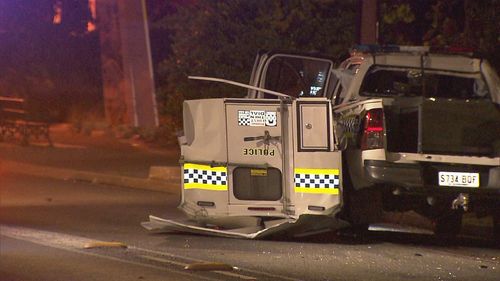 A﻿ marked police car has rolled "several times" after a Ford sedan crashed into it on a suburban street in Victor Harbor in Adelaide's south.