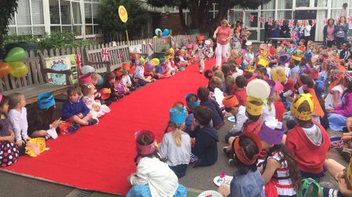 The kids were told to wear red, white and blue and made dresses and suits out of newspaper. (Supplied)