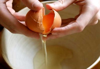 Step one: Break egg into ramekin